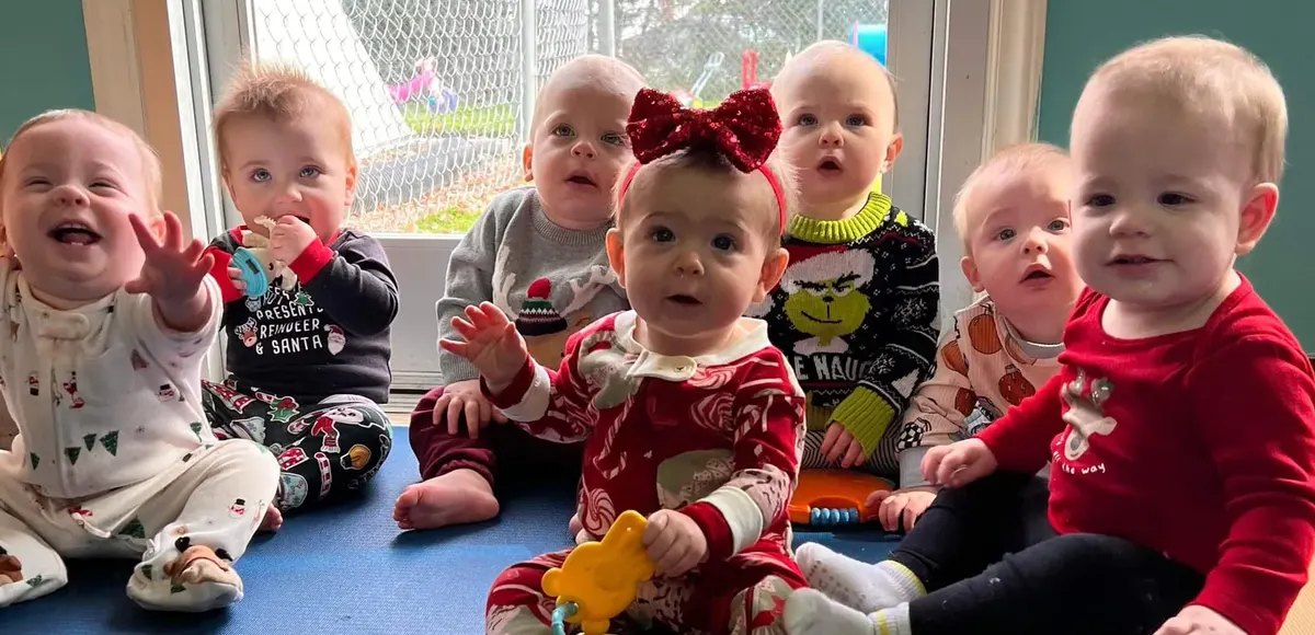 Smiling infants in the Beansprout Academy infant room
