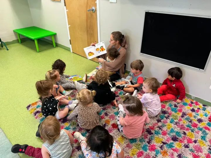 Beansprout Academy teacher reading a story to children